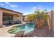 Inviting backyard oasis with a private pool, covered patio, and lush landscaping, perfect for outdoor entertaining at 17152 W Watkins St, Goodyear, AZ 85338