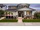 Charming two-story home featuring a well-manicured lawn and inviting front porch at 17160 W Montpelier St, Surprise, AZ 85388