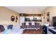 Open living space features hardwood floors, a sofa, and a view of the kitchen, ideal for entertaining at 18416 N Cave Creek Rd # 3050, Phoenix, AZ 85032