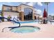 A community pool and spa offer lounge chairs and tables with umbrellas for relaxing poolside at 18416 N Cave Creek Rd # 3050, Phoenix, AZ 85032