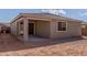 Exterior view of a home with a covered patio and large windows at 18498 E Dario Rd, Gold Canyon, AZ 85118