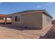 Home exterior and backyard with privacy fence and low maintenance landscaping at 18498 E Dario Rd, Gold Canyon, AZ 85118