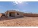 Backyard with privacy wall and low maintenance landscaping and covered patio at 18498 E Dario Rd, Gold Canyon, AZ 85118