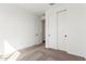Bright bedroom features neutral carpet and a closet with sliding doors at 18498 E Dario Rd, Gold Canyon, AZ 85118