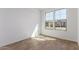 Bright bedroom with wood-look tile floors and natural light from the window at 18498 E Dario Rd, Gold Canyon, AZ 85118