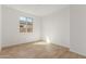 A well-lit bedroom with tile floors and bright light from the window at 18498 E Dario Rd, Gold Canyon, AZ 85118