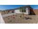 Street view of a row of attractive, modern homes with manicured landscaping, including stone and desert rock at 18498 E Dario Rd, Gold Canyon, AZ 85118