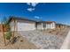 Attractive home with a two-car garage, gray-brick driveway, well-maintained front yard, and manicured landscaping at 18498 E Dario Rd, Gold Canyon, AZ 85118