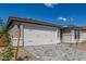 Charming home featuring a two-car garage and manicured landscaping at 18498 E Dario Rd, Gold Canyon, AZ 85118