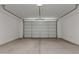 Spacious two car garage with concrete floors and white walls at 18498 E Dario Rd, Gold Canyon, AZ 85118