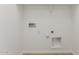 White laundry room with hookups and tile flooring ready for appliances at 18498 E Dario Rd, Gold Canyon, AZ 85118