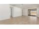 Spacious living room featuring tile flooring, white walls, recessed lighting, and a sliding glass door at 18498 E Dario Rd, Gold Canyon, AZ 85118
