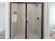 Modern walk-in shower features a tiled surround and a sliding glass door at 18498 E Dario Rd, Gold Canyon, AZ 85118