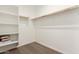 Spacious walk-in closet featuring shelving and wooden closet rod at 18498 E Dario Rd, Gold Canyon, AZ 85118