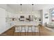 Modern, bright kitchen with white cabinets, a quartz countertop island, and stainless steel appliances at 19203 N 39Th Way, Phoenix, AZ 85050