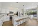 Bright kitchen area has quartz counters, stainless appliances, a kitchen island, and a breakfast nook at 19203 N 39Th Way, Phoenix, AZ 85050