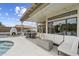 Outdoor patio with a fireplace, seating, and fire pit near the pool at 19203 N 39Th Way, Phoenix, AZ 85050