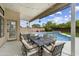 Covered patio with dining table, seating area, and view of the backyard pool at 19203 N 39Th Way, Phoenix, AZ 85050