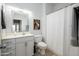 Neat bathroom with a shower and tub combination along with vanity and artistic touches at 19777 N 76Th St # 3229, Scottsdale, AZ 85255