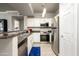 Modern kitchen with stainless steel appliances and sleek white cabinets at 19777 N 76Th St # 3229, Scottsdale, AZ 85255
