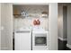 Efficient laundry area with modern appliances and shelving for storage at 19777 N 76Th St # 3229, Scottsdale, AZ 85255