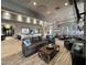 Lounge area with a comfortable sofa, TVs, decorative pillows, and stylish modern furnishings at 19777 N 76Th St # 3229, Scottsdale, AZ 85255