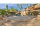 Relaxing outdoor spa with lounge seating, umbrellas, and landscaping for added privacy at 19777 N 76Th St # 3229, Scottsdale, AZ 85255