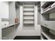 Well-organized walk-in closet with adjustable shelves and rods for optimal storage at 19777 N 76Th St # 3229, Scottsdale, AZ 85255