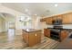 Well-equipped kitchen with stainless steel appliances and center island at 206 N 152Nd Ave, Goodyear, AZ 85338