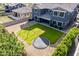 This is a expansive backyard with a trampoline, swing set, and lush lawn, as seen from an aerial perspective at 21341 S 227Th Way, Queen Creek, AZ 85142