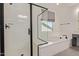 Updated bathroom showcasing a separate shower and soaking tub with modern fixtures at 21341 S 227Th Way, Queen Creek, AZ 85142