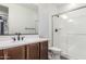 Modern bathroom showcasing a sleek vanity, a spacious shower with glass doors, and contemporary fixtures at 21341 S 227Th Way, Queen Creek, AZ 85142