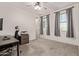 Bright bedroom with an office setup and great natural light at 21341 S 227Th Way, Queen Creek, AZ 85142