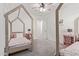 Bright bedroom with two beds, ceiling fan, and natural light at 21341 S 227Th Way, Queen Creek, AZ 85142