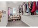 Walk-in closet featuring shelving and ample storage space at 21341 S 227Th Way, Queen Creek, AZ 85142