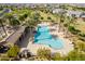 Resort-style community pool surrounded by palm trees and lounge chairs is perfect for relaxing and soaking up the sun at 21341 S 227Th Way, Queen Creek, AZ 85142