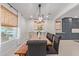 Open-concept dining room with a large window and elegant decor at 21341 S 227Th Way, Queen Creek, AZ 85142