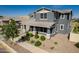Inviting two-story home features a covered entry and landscaped yard offering great curb appeal at 21341 S 227Th Way, Queen Creek, AZ 85142