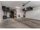 Well-organized garage with overhead racks and shelving to maximize storage space and functionality at 21341 S 227Th Way, Queen Creek, AZ 85142