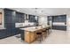 This expansive kitchen includes a large island and modern appliances at 21341 S 227Th Way, Queen Creek, AZ 85142