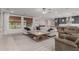 Bright living room features a large sectional, ceiling fan, and windows with woven shades at 21341 S 227Th Way, Queen Creek, AZ 85142