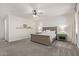 Serene primary bedroom offers a ceiling fan, side tables, and large windows at 21341 S 227Th Way, Queen Creek, AZ 85142