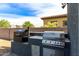 Outdoor kitchen area featuring a built-in grill and stainless steel appliances at 21341 S 227Th Way, Queen Creek, AZ 85142