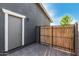 Side yard area with a privacy gate, a door, and paver flooring at 21341 S 227Th Way, Queen Creek, AZ 85142