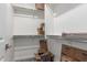 Empty storage room with shelving, featuring ample space for boxes, and a neutral color scheme at 21341 S 227Th Way, Queen Creek, AZ 85142