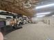 Spacious attic featuring ample storage space with shelving and a ping pong table for recreation at 21615 E Pegasus Pkwy, Queen Creek, AZ 85142
