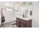 Bathroom featuring a modern vanity and a glass-enclosed shower with subway tile at 21615 E Pegasus Pkwy, Queen Creek, AZ 85142