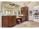 Primary bathroom featuring dual sinks, granite counters, a ceiling fan, and vanity area at 21615 E Pegasus Pkwy, Queen Creek, AZ 85142