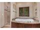 Bathroom showcasing a standalone tub with dark wood trim and granite countertops at 21615 E Pegasus Pkwy, Queen Creek, AZ 85142