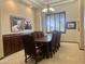 Classic dining room features neutral walls, a chandelier, and dark wood accents at 21615 E Pegasus Pkwy, Queen Creek, AZ 85142
